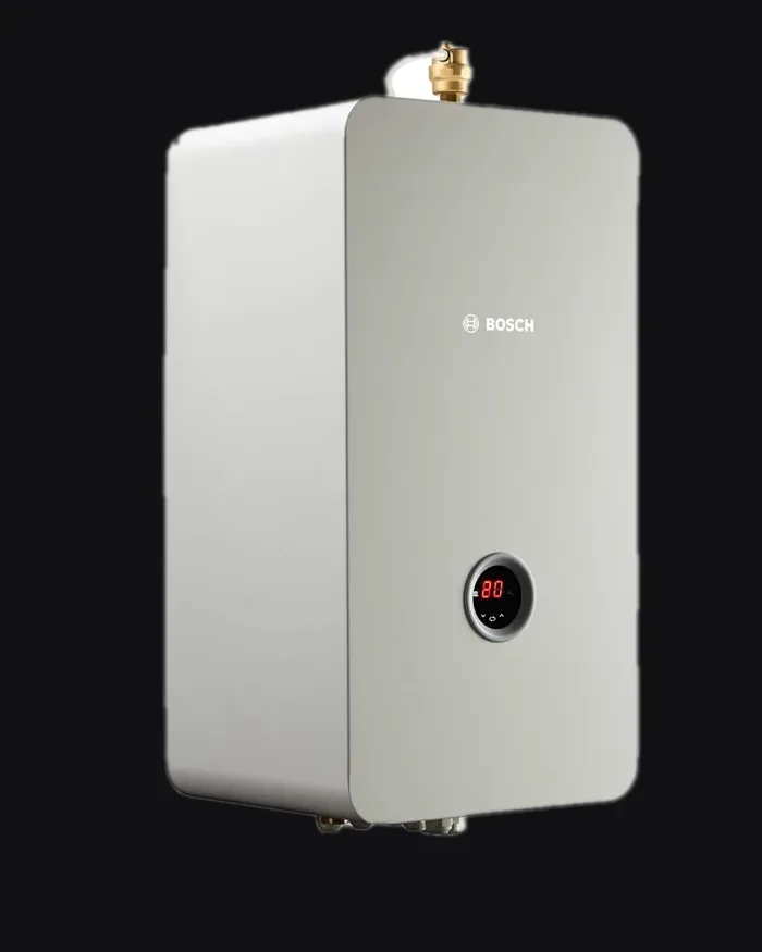White wall-mounted boiler carrying the Bosch logo and a round display, with the connections underneath.